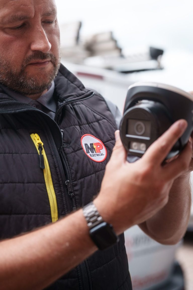 MP Electrical engineer in branded workwear on a job in Rotherham