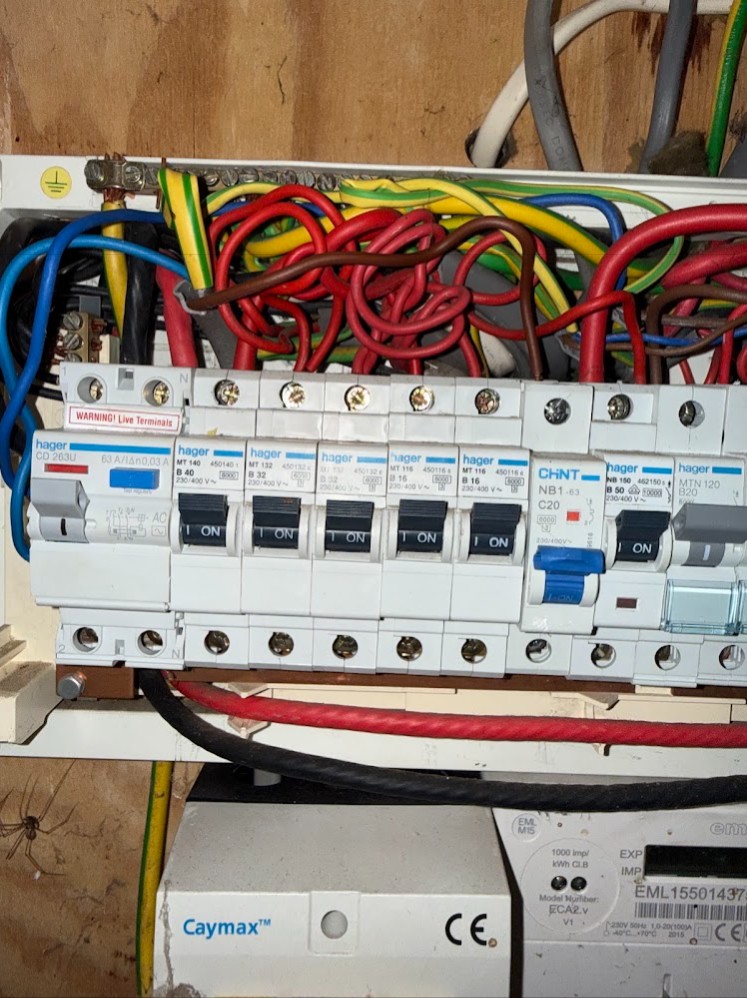 Close up of circuit breakers inside a newly installed consumer unit